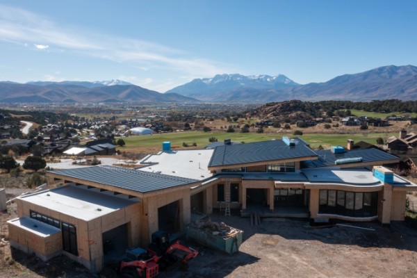 Large residential roofing project with valley views